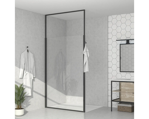 Modernt badrum med duschkabin, tvättställ och handduk