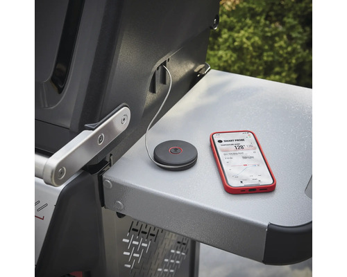 Smart Probe temperaturmätare med smartphone på ett grillbord