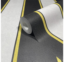 Tapetrulle med randigt mönster i svart, vitt och gult