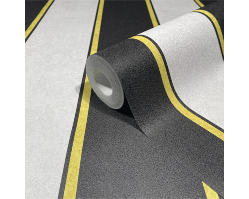 Tapetrulle med randigt mönster i svart, vitt och gult