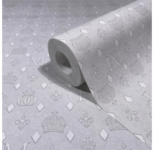 Rulle papperstapet med kron- och bokstavsmönster