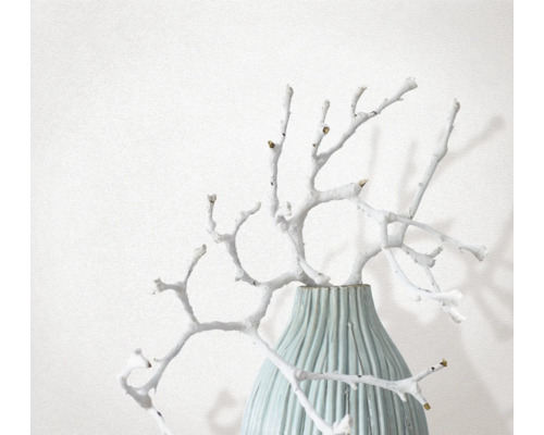 Dekorativa grenar i räfflad vas