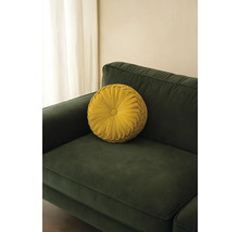 Rund dekorativ kudde på en soffa