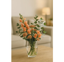 Blombukett med lejongap och eukalyptus i glasvas