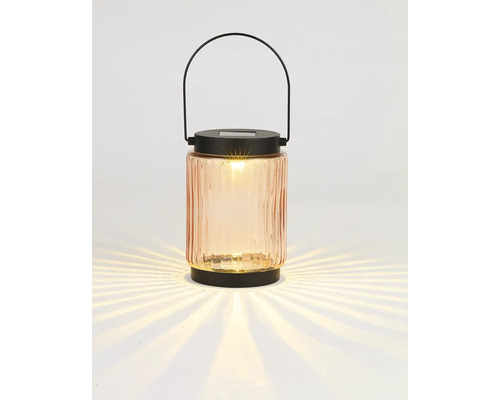 Dekorativ solarlampa av glas med handtag