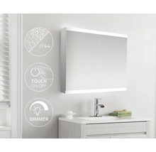 Badrum med spegelskåp, handfat och armatur. Symbolerna visar IP44-skydd, touch-on-off-funktion och dimmerfunktion.