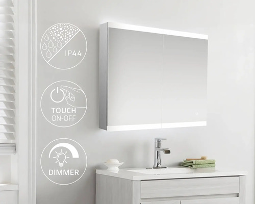 Badrum med spegelskåp, handfat och armatur. Symbolerna visar IP44-skydd, touch-on-off-funktion och dimmerfunktion.