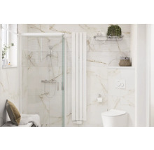 Badrum med dusch, element och toalett i en ljus och rymlig design.