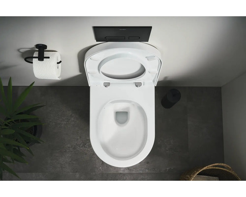 Vy från ovan av en toalett med öppet toalettlock, manöverpanel och toalettpappershållare