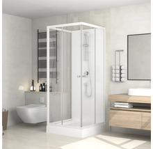 Ljust badrum med dusch, toalett, handfat och radiator