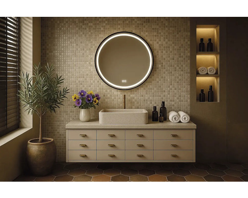 Badrum med tvättställsskåp, tvättställsskål, spegel med LED-belysning och dekoration