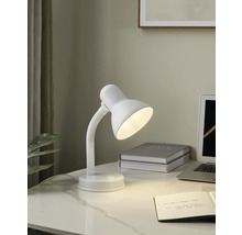 Skrivbordsscen med en vit skrivbordslampa, en anteckningsbok och en bärbar dator