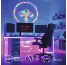 Flexibel RGBIC LED-list som 360 graders dekorativ belysning på vägg och skrivbord i ett arbetsrum med dator. Briloner Logo.