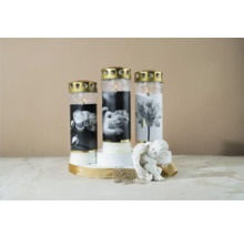 Tre gravljus med olika motiv och en ängelfigur