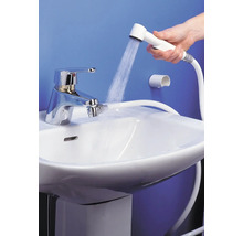 Bidéblandare med handdusch på ett handfat med vattenstråle