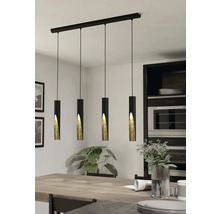 Pendellampa med fyra lampor över ett matbord