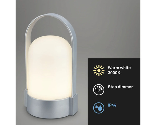 Bärbar LED-bordslampa med silverfärgat hölje och handtag, varmvitt ljus 3000 Kelvin, stegvis dimmer och kapslingsklass IP44.