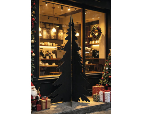 Svart julgranssilhuett i trä eller metall framför ett skyltfönster med juldekorationer och paket.