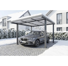 Modern carport i aluminium med en SUV under i ett snöigt vinterlandskap.