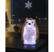 LED-dekorationsfigur igelkott av akryl med en kristalliknande yta, stående på ett bord i ett festligt dekorerat rum med juldekorationer.