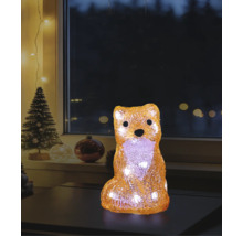 LED-dekorationsfigur räv i akryl med varmvitt ljus i julstämning på ett bord framför ett fönster.