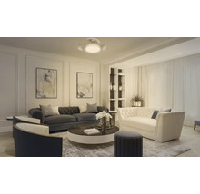 Modernt, rymligt vardagsrum med Chesterfield-soffor, fåtöljer, ett runt soffbord, abstrakt väggkonst och en takfläkt med lampa.