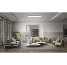 Rektangulär LED-takpanel i ett modernt, rymligt vardagsrum med sittgrupp och väggpaneler.