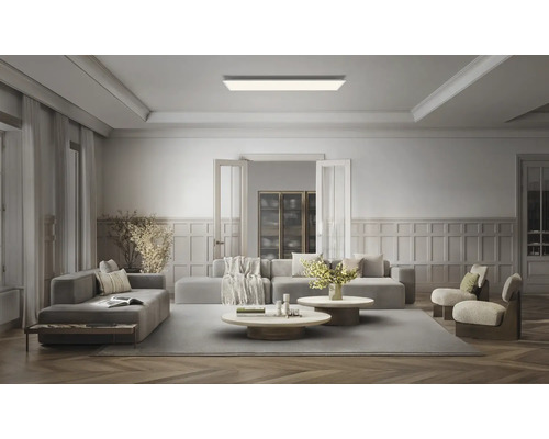 Rektangulär LED-takpanel i ett modernt, rymligt vardagsrum med sittgrupp och väggpaneler.