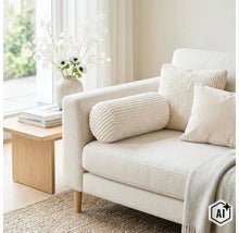 En ljus soffa med nackkudde i manchester, prydnadskuddar och en pläd i ett modernt vardagsrum med sidobord och blomvas. (Image AI modified or generated)