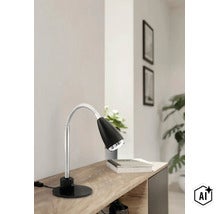 Modern skrivbordslampa med flexibel hals på en trähylla i ett ljust rum. (Image AI modified or generated)