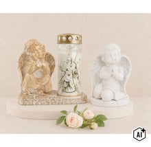 Gravdekoration set bestående av två änglafigurer i konststen och ett gravljus med blommönster på en sockel. (Image AI modified or generated)