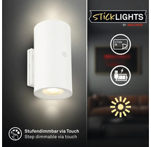 Cylindrisk vägglampa med LED för montering med lim från Briloner med touchdimmer och batteri med USB laddning.