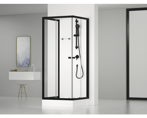 Hörndusch med svart ram och duschblandare i modernt badrum.