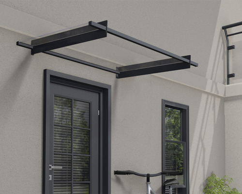 Tak av glas och metall ovanför en ytterdörr