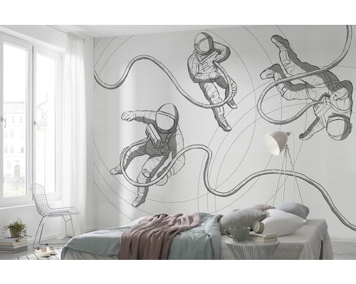 Sovrum med fototapet med astronautmotiv på väggen