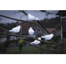 Dekorativa ljusfigurer fåglar på ett träd