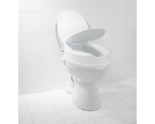 Toalettförhöjning på en toalett i badrummet.