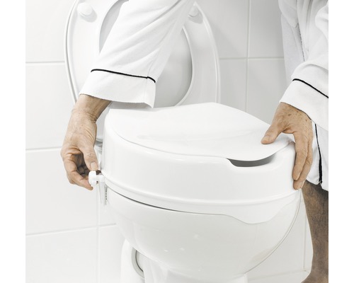 Toalettförhöjning monterad på en toalett