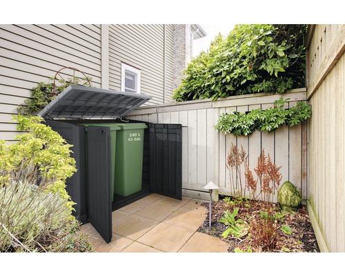 Soptunnebox med en 240 liters soptunna i trädgården