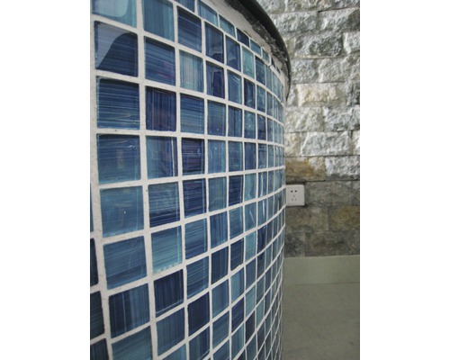 Detalj av ett runt objekt med mosaikplattor