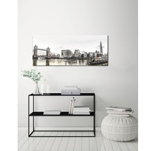 Dekorativ canvas med Londons stadsbild ovanför en svart hylla