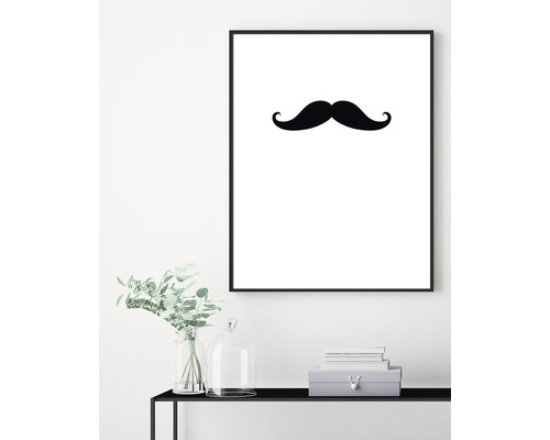 Dekorativ väggbild med svart mustaschmotiv i ram