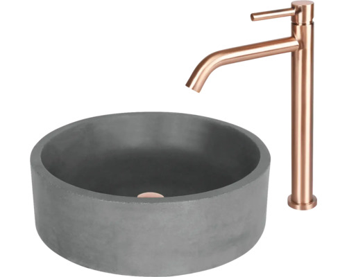 Grått tvättställ i betong med blandare