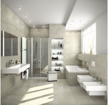 Modernt badrum med dusch, badkar, tvättställ och toalett i ljus design