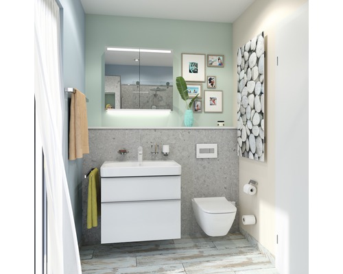 Ljust badrum med tvättställsskåp, spegelskåp, toalett och element