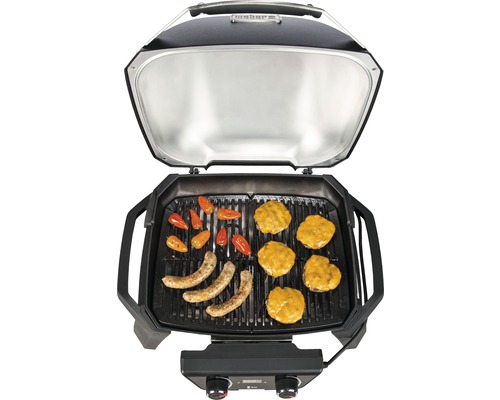 Öppen elektrisk grill med korv, paprika och hamburgare