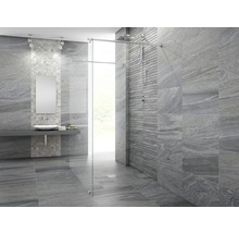 Modernt badrum med grå kakel, dusch och handfat