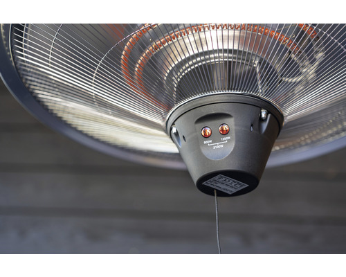 Detaljvy av en värmelampa med olika värmelägen.