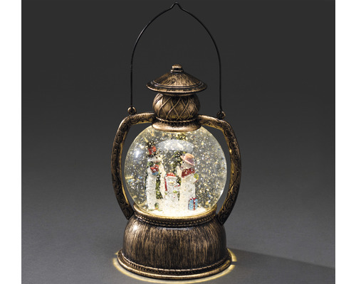 Snögloblykta med snögubbefamilj