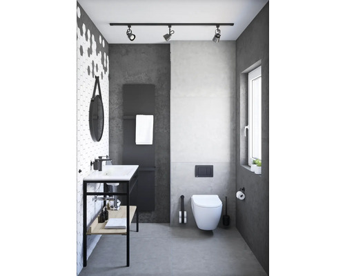 Modernt badrum med handfat, toalett och grå accenter